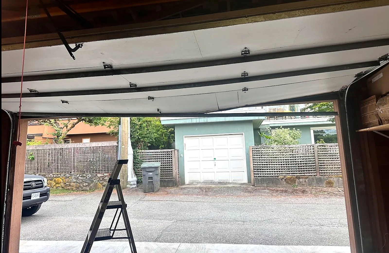 An open garage door showing the inside of the garage